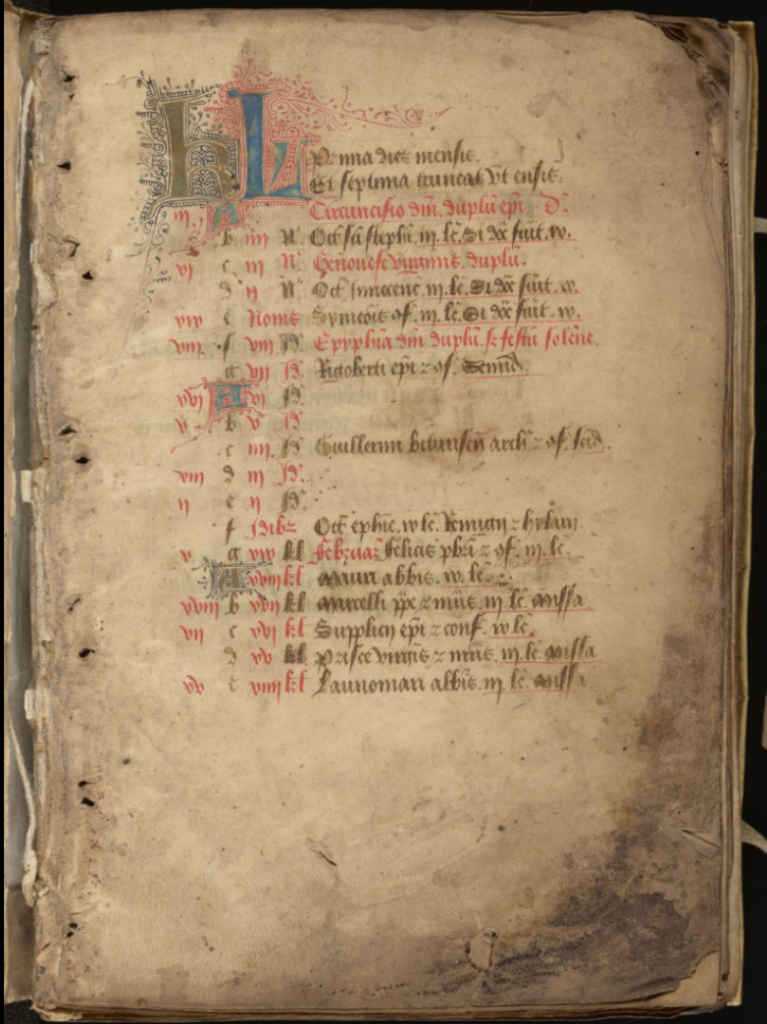 a medieval calendar page, lines written in red and black