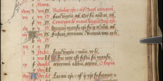 a medieval calendar page with lines written in red and black